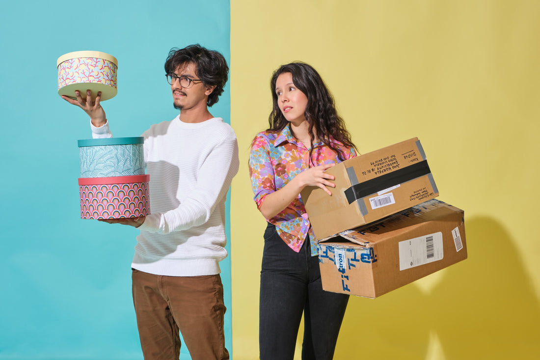 replatforming from magento to shopify plus. Two people are comparing boxes