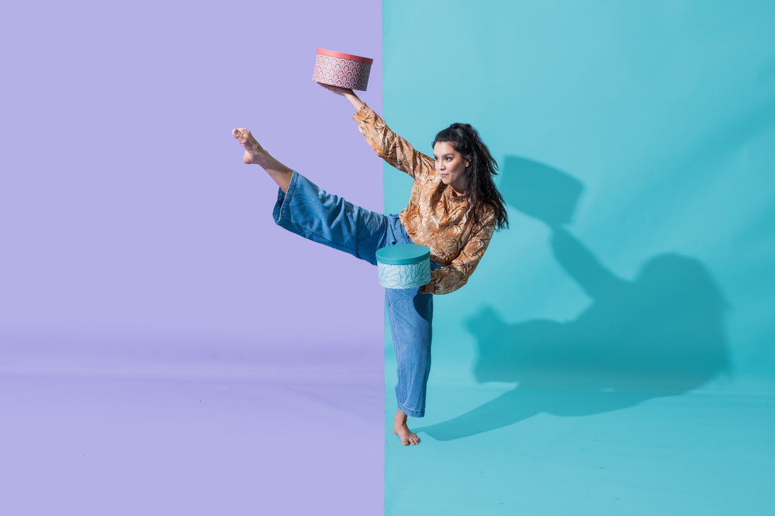 Sustainability women balancing boxes