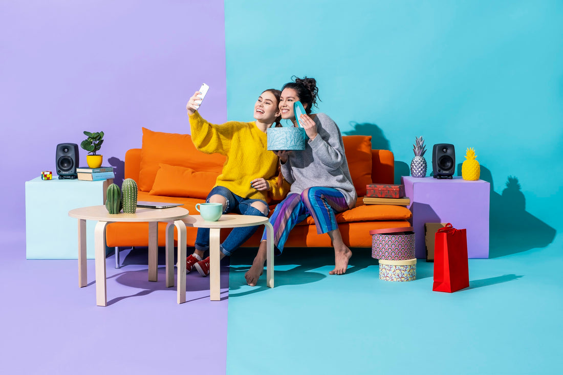 women smiling with phones and products, omnichannel retailing